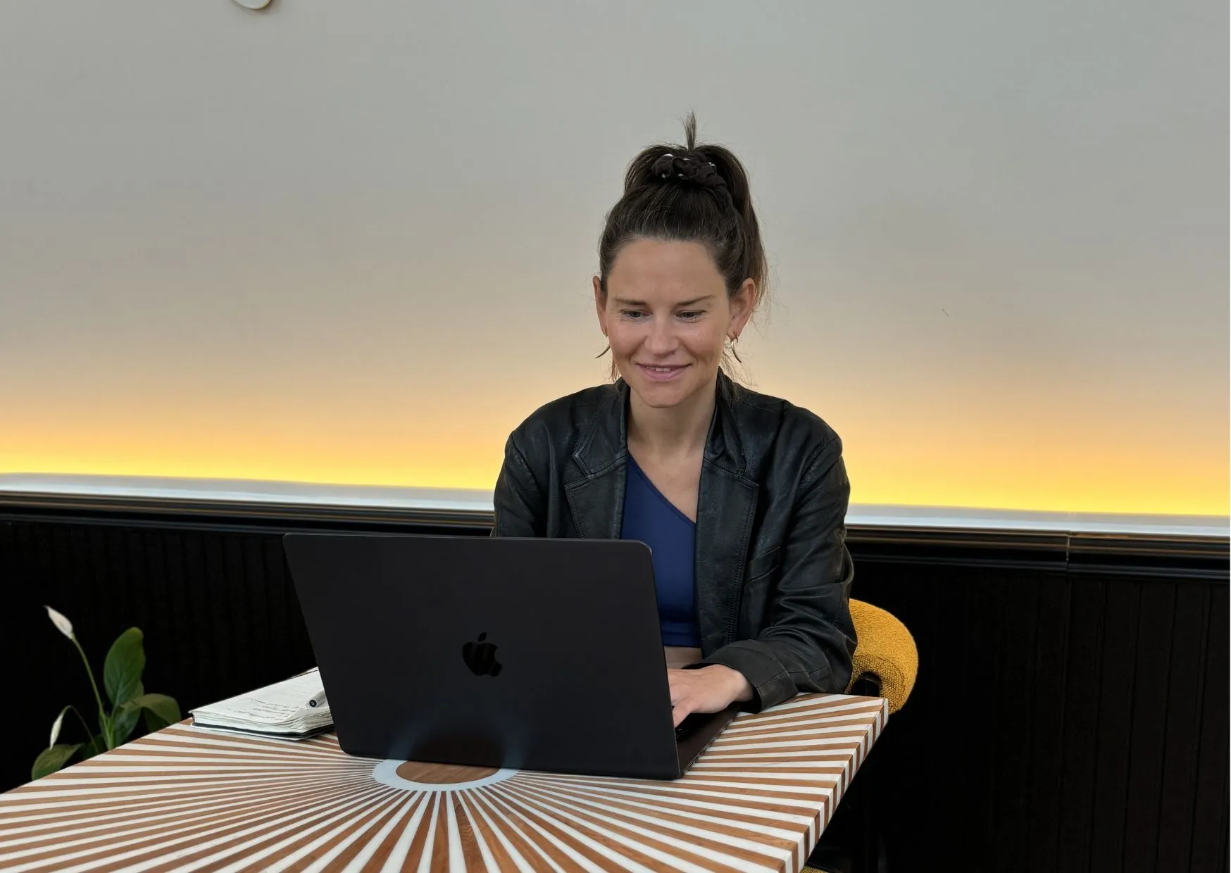 Dine working at her laptop